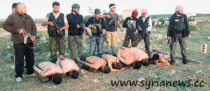 Abdul Samad Issa is standing on the right with his gun, and he fires the first headshot.