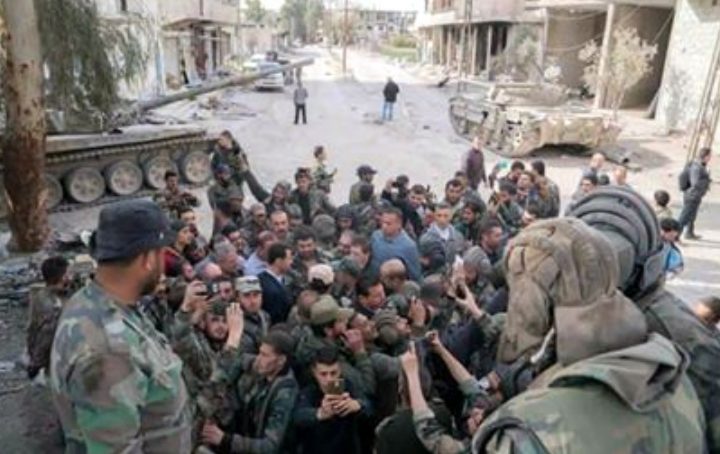 image-President Assad, surrounded by members of the courageous Syrian Arab Army.