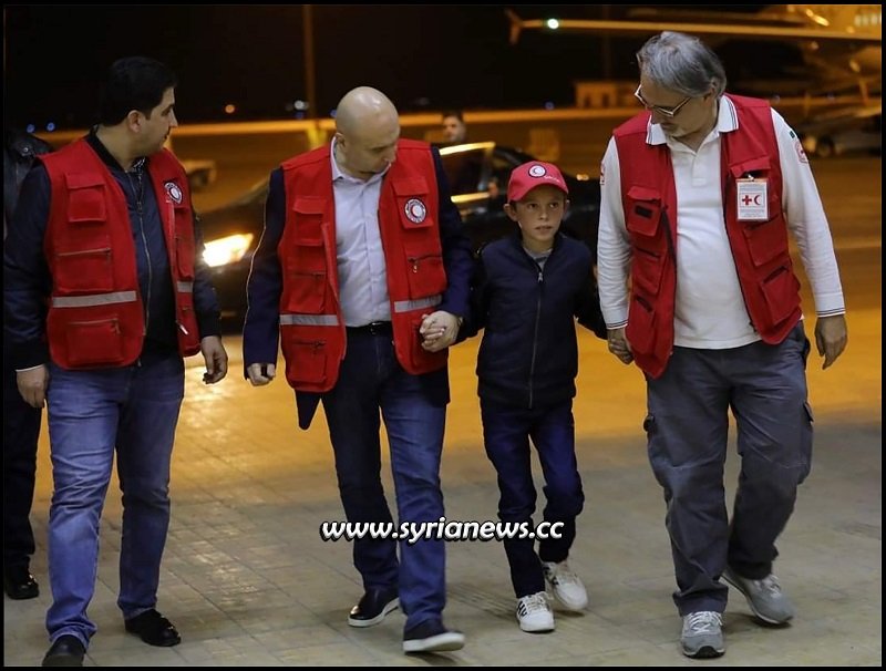 Syrian Red Crescent SRC with Albanian child Alvin heading to Damascus from Hasakah Al Hol going to Italy