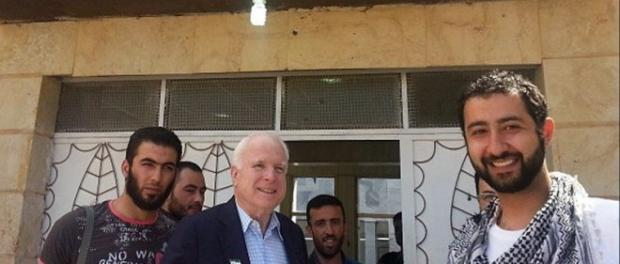US loose senator John McCain in a memorial picture with the kidnappers of Lebanese men