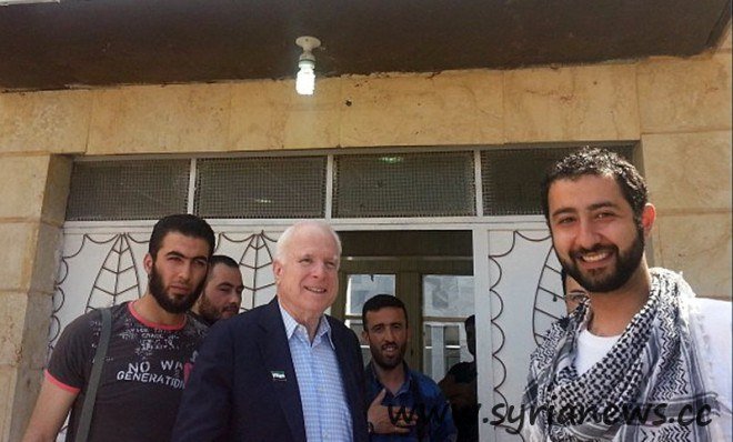 US loose senator John McCain in a memorial picture with the kidnappers of Lebanese men