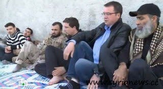 Vadim Fefilow (NTV) between jihadists in Aleppo.