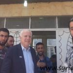 Hawkish US Senator John McCain (C) poses with infamous kidnapper in Syria, Mohamed Nour (seen with his hand on his chest and holding a camera)