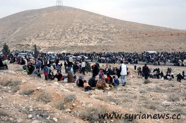 Adra residents being led to saftey by the Syrian Arab Army