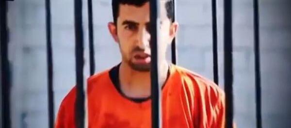 Jordanian Pilot Moath Kassasbeh in the Cage Awaiting to be Burnt Alive