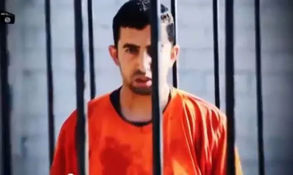 Jordanian Pilot Moath Kassasbeh in the Cage Awaiting to be Burnt Alive