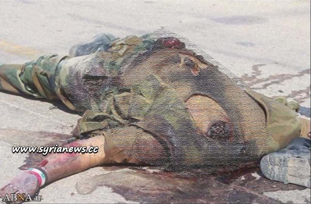 image-decapitated body of slain Syrian soldier Blurred