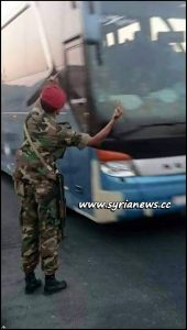 image-SAA Soldier Greets Ahrar Cham Terrorists on their way to Idlib