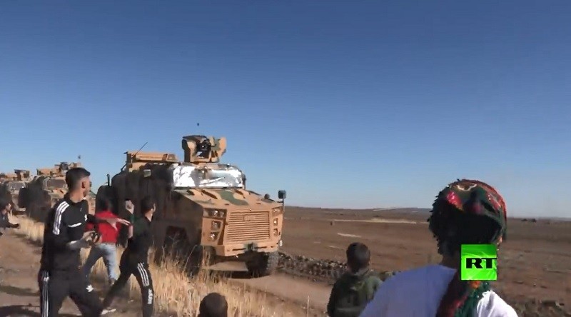 Syrians stoning Erdogan Forces