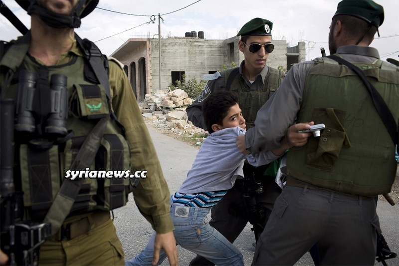 Israel IDF armed soldiers kidnap Palestinian child