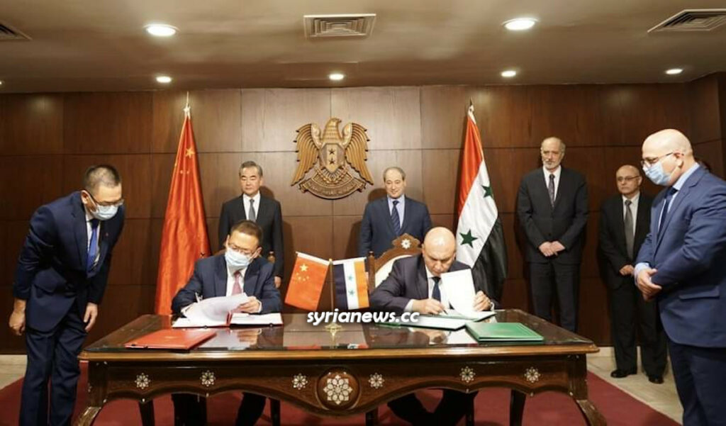 Chinese Foreign Minister Wang Yi holds takls in Damascus and signs economic agreement