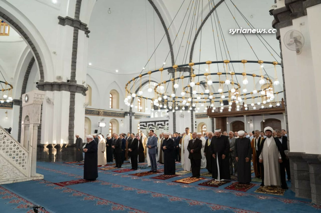President Bashar Assad performs Eid Adha prayers in Khalid Ibn Al Waleed Mosque in Homs