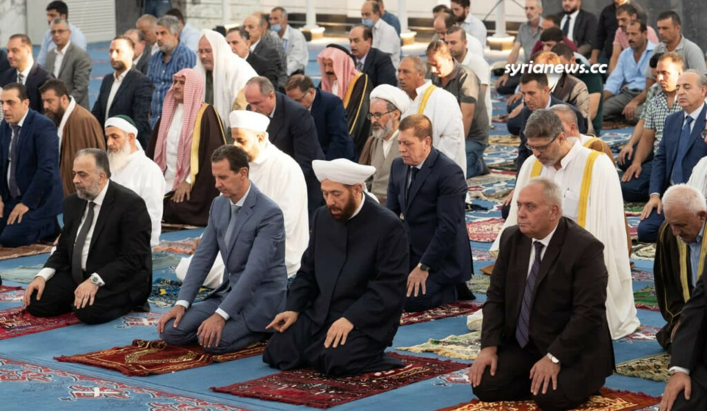 President Bashar Assad performs Eid Adha prayers in Khalid Ibn Al Waleed Mosque in Homs