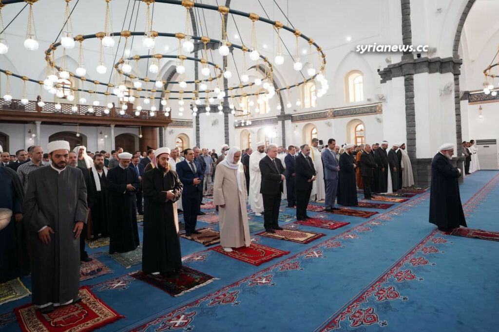 President Bashar Assad performs Eid Adha prayers in Khalid Ibn Al Waleed Mosque in Homs