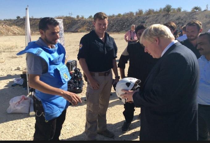 BJ in fondling photo op with death squad & child trafficking White Helmets.