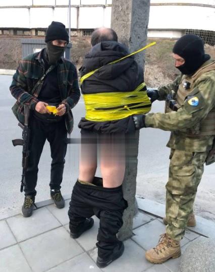 Ukraine Nazi soldiers torture civilian man.
